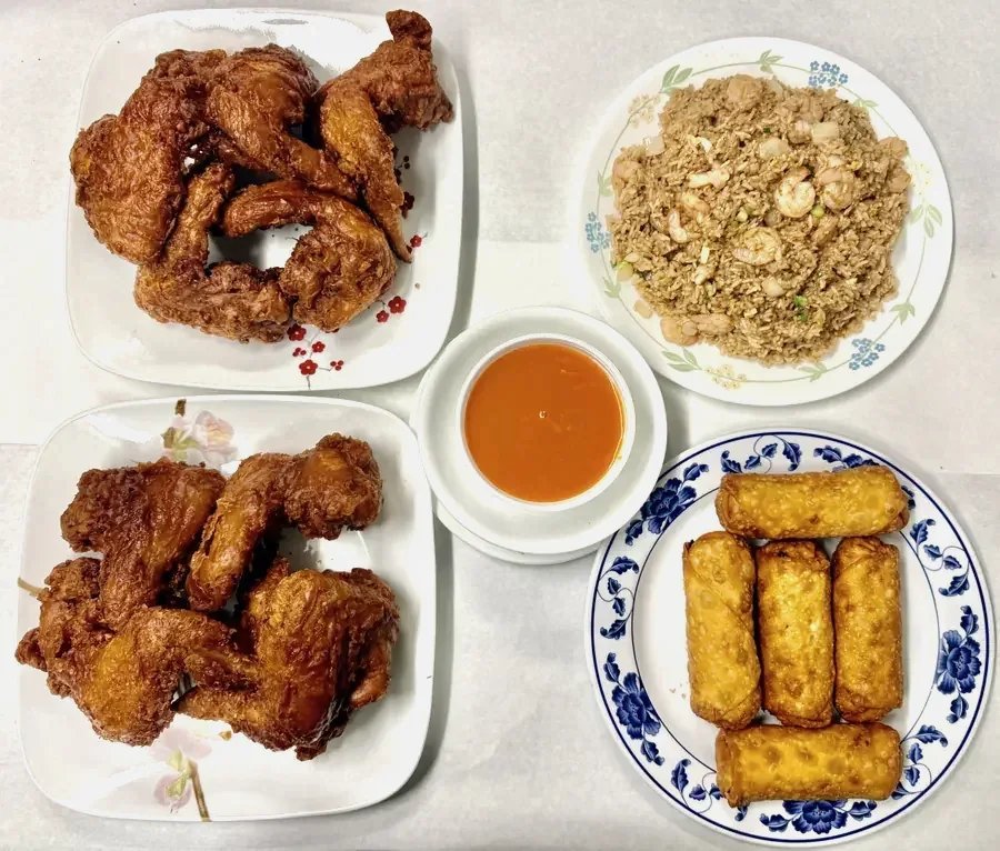 Menu-style spread with chicken, noodles, and dumplings.