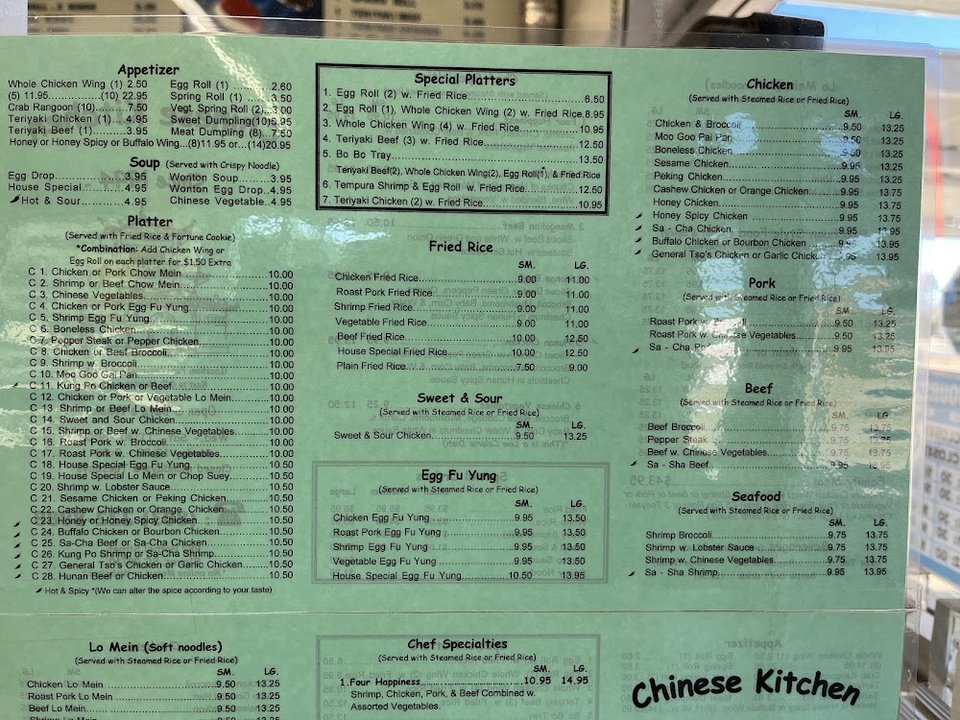 Chinese dishes served with rice and vegetables.